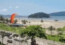 Homem cai de paraglider e é salvo por equipamento preso em poste